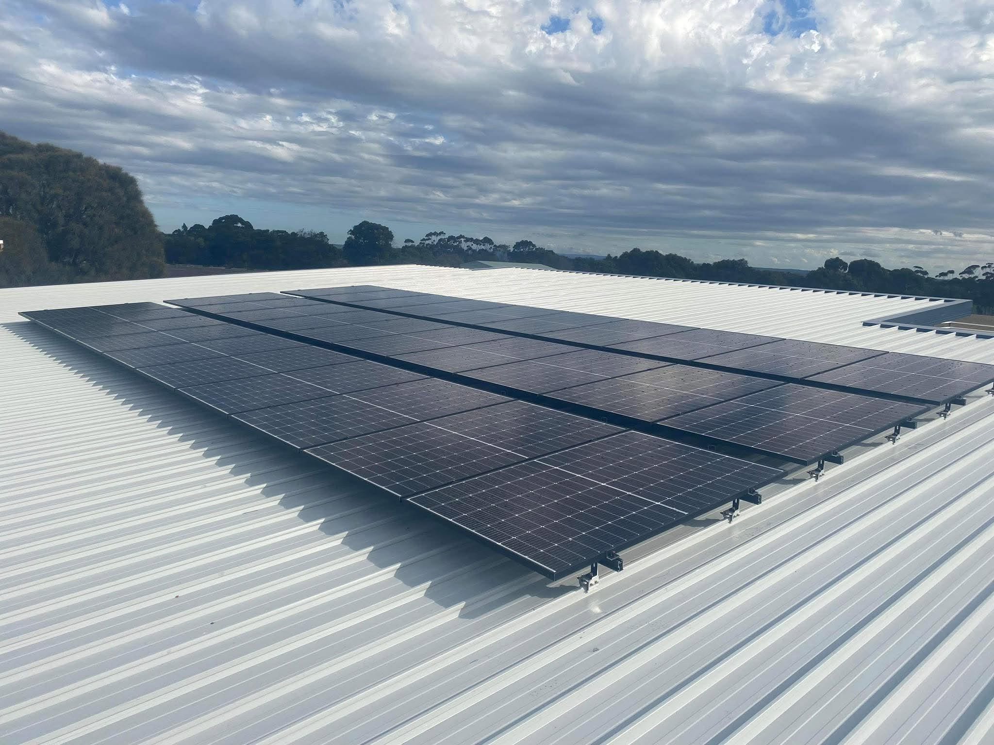 Original Vortex solar installation showing an array on a metal roof
