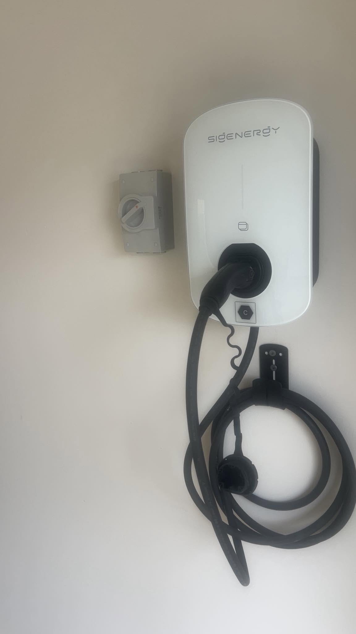 Wall-mounted home EV charger installation.